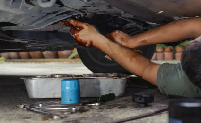 Use Oil Pan & Socket Wrench
